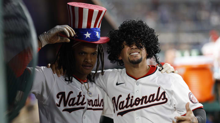 Aug 20, 2024; Washington, District of Columbia, USA; Washington Nationals shortstop CJ Abrams (5) celebrates with Nationals second baseman Ildemaro Vargas (R) in the dugout after hitting a solo home run against the Colorado Rockies during the sixth inning at Nationals Park. 