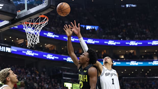 Mar 27, 2024; Salt Lake City, Utah, USA; Utah Jazz guard Collin Sexton (2) goes to the basket against San Antonio Spurs cente