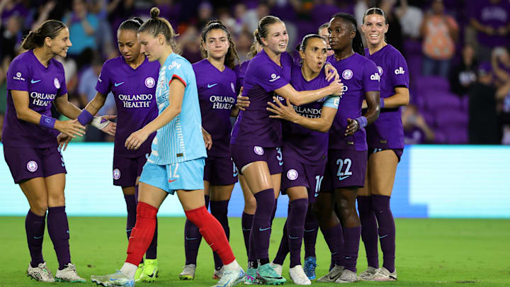 Nov 8, 2024; Orlando, Florida, USA; Orlando Pride forward Marta (10) celebrates with midfielder Coriana Dyke (31) after scoring a goal against the Chicago Red Stars in the second half in a 2024 NWSL Playoffs quarterfinal match at Inter&Co Stadium. Mandatory Credit: Mike Watters-Imagn Images