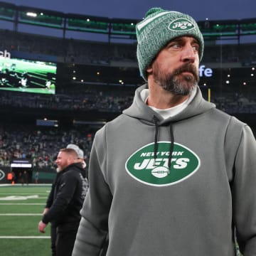 Dec 24, 2023; East Rutherford, New Jersey, USA; New York Jets quarterback Aaron Rodgers (8) on the field after the game against the Washington Commanders at MetLife Stadium.