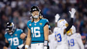 Jan 14, 2023; Jacksonville, Florida, USA; Jacksonville Jaguars quarterback Trevor Lawrence (16) reacts after throwing his third interception of the first quarter against the Los Angeles Chargers during a wild card game at TIAA Bank Field. Mandatory Credit: Mark J. Rebilas-Imagn Images