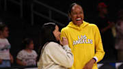 Aug 12, 2025; Los Angeles, California, USA;  Los Angeles Sparks forward Azura Stevens (23, right) chats with New York Liberty head coach Sandy Brondello (left) before the game at Crypto.com Arena. Mandatory Credit: Kiyoshi Mio-Imagn Images