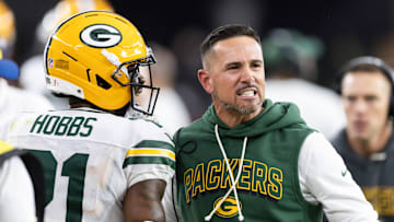 Oct 19, 2025; Glendale, Arizona, USA; Green Bay Packers head coach Matt LaFleur with cornerback Nate Hobbs (21) against the Arizona Cardinals at State Farm Stadium. Mandatory Credit: Mark J. Rebilas-Imagn Images