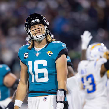 Jan 14, 2023; Jacksonville, Florida, USA; Jacksonville Jaguars quarterback Trevor Lawrence (16) reacts after throwing his third interception of the first quarter against the Los Angeles Chargers during a wild card game at TIAA Bank Field. Mandatory Credit: Mark J. Rebilas-Imagn Images