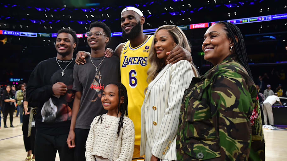 Los Angeles Lakers forward LeBron James poses with sons Bronny and Bryce, daughter Zhuri, wife Savannah and mother Gloria.
