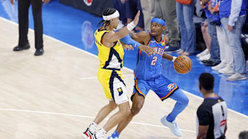 Jun 22, 2025; Oklahoma City, Oklahoma, USA; Oklahoma City Thunder guard Shai Gilgeous-Alexander (2) controls the ball againstIndiana Pacers guard Andrew Nembhard (2) during the first half of game seven of the 2025 NBA Finals at Paycom Center. Mandatory Credit: Alonzo Adams-Imagn Images