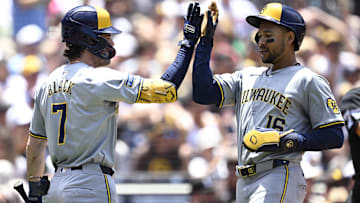 Jun 23, 2024; San Diego, California, USA; Milwaukee Brewers center fielder Blake Perkins (16) is congratulated by first baseman Tyler Black (7) after scoring a run against the San Diego Padres during the second inning at Petco Park. Mandatory Credit: Orlando Ramirez-USA TODAY Sports
