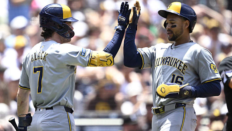 Jun 23, 2024; San Diego, California, USA; Milwaukee Brewers center fielder Blake Perkins (16) is congratulated by first baseman Tyler Black (7) after scoring a run against the San Diego Padres during the second inning at Petco Park. Mandatory Credit: Orlando Ramirez-USA TODAY Sports