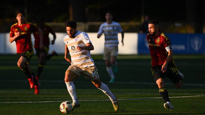 May 8, 2024; Tukwila, Washington, USA; Louisville City FC forward Adrien Perez (16) advances the ball while defended by Seattle Sounders FC midfielder Alex Roldan (16) during the first half at Starfire Sports Complex. Mandatory Credit: Steven Bisig-Imagn Images