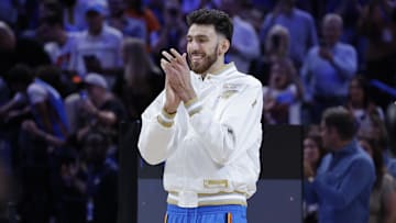 Oct 21, 2025; Oklahoma City, Oklahoma, USA; Oklahoma City Thunder center Chet Holmgren walks onto the court to receive his championship ring during the ring ceremony at Paycom Center. Mandatory Credit: Alonzo Adams-Imagn Images