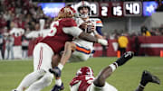 Alabama Crimson Tide DT Tim Keenan III hits Auburn Tigers quarterback Payton Thorne for a loss.