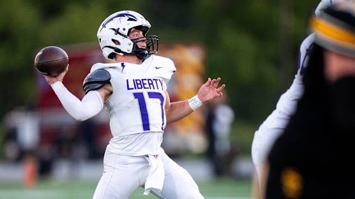Iowa City Liberty's Reece Rettig (17) looks to throw towards the end zone during a game against Southeast Polk on Sept. 5, 2025, at Southeast Polk High School. Iowa City Liberty's Reece Rettig (17) looks to throw towards the end zone during a game against Southeast Polk on Sept. 5, 2025, at Southeast Polk High School.