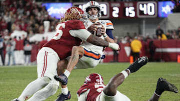 Nov 30, 2024; Tuscaloosa, Alabama, USA;  Alabama Crimson Tide defensive lineman Tim Keenan III (96) hits Auburn Tigers quarterback Payton Thorne (1)  for a loss during the second half at Bryant-Denny Stadium. Alabama won 28-14. Mandatory Credit: Gary Cosby Jr.-Imagn Images