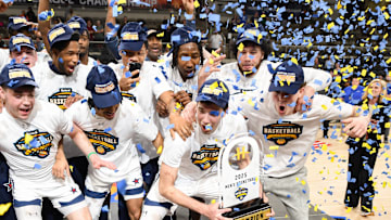 Mar 11, 2025; Indianapolis, IN, USA; The Robert Morris Colonials celebrate after defeating the Youngstown State Penguins to win the Horizon League Championship at Corteva Coliseum. Mandatory Credit: Robert Goddin-Imagn Images
