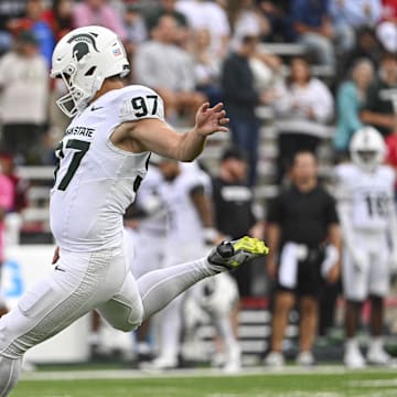 Sep 7, 2024; College Park, Maryland, USA;  Michigan State Spartans place kicker Jonathan Kim (97) kicks a extra point during the first half against the Maryland Terrapins at SECU Stadium. Mandatory Credit: Tommy Gilligan-Imagn Images