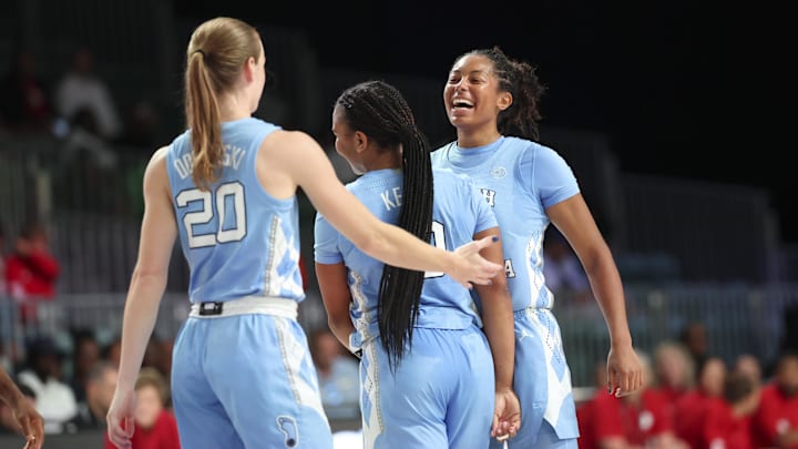 Nov 25, 2024; Paradise Island, Bahamas, BHS; North Carolina Tar Heels guard Indya Nivar (24) celebrates with North Carolina Tar Heels guard Reniya Kelly (10) and North Carolina Tar Heels guard Lexi Donarski (20) during the second half against the Indiana Hoosiers at the Atlantis Resort. Mandatory Credit: Kevin Jairaj-Imagn Images