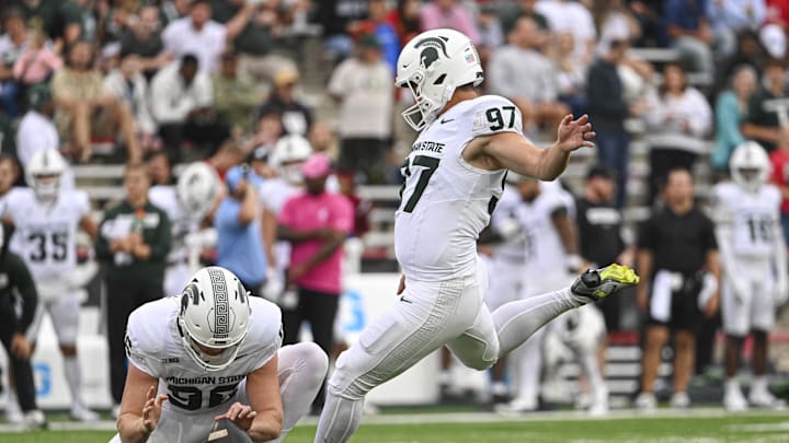 Sep 7, 2024; College Park, Maryland, USA;  Michigan State Spartans place kicker Jonathan Kim (97) kicks a extra point during the first half against the Maryland Terrapins at SECU Stadium. Mandatory Credit: Tommy Gilligan-Imagn Images