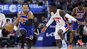 Apr 24, 2025; Detroit, Michigan, USA; New York Knicks guard Jalen Brunson (11) dribbles defended by Detroit Pistons guard Dennis Schroder (17) in the first half during game three of first round for the 2024 NBA Playoffs at Little Caesars Arena. Mandatory Credit: Rick Osentoski-Imagn Images