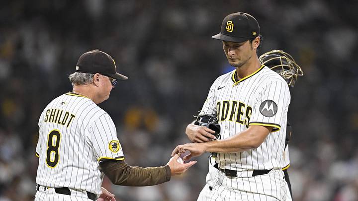 Sep 2, 2025; San Diego, California, USA; San Diego Padres starting pitcher Yu Darvish (11) hands the ball to manager Mike Shildt (8) as he leaves the game during the fifth inning against the Baltimore Orioles at Petco Park. Mandatory Credit: Denis Poroy-Imagn Images