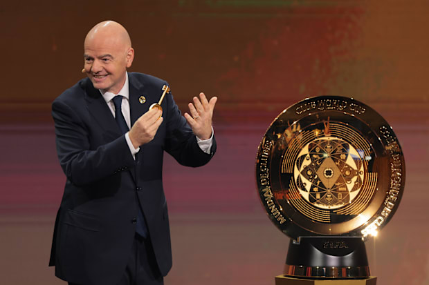 FIFA president Gianni Infantino presents the FIFA Club World Cup trophy during the Club Word Cup draw at Telemundo Studios.