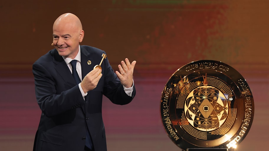 FIFA president Gianni Infantino presents the FIFA Club World Cup trophy during the Club Word Cup draw at Telemundo Studios.