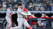 Oct 1, 2025; Bronx, New York, USA; Boston Red Sox third baseman Alex Bregman (2) hits a single during the eighth inning against the New York Yankees during game two of the Wildcard round for the 2025 MLB playoffs at Yankee Stadium. Mandatory Credit: Brad Penner-Imagn Images