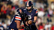 Nashville Christian's Jared Curtis (2) hands off to Terry Ward (10) during the second quarter of the Division II-A championship game against Columbia Academy at Finley Stadium in Chattanooga, Tenn., Thursday, Dec. 5, 2024.
