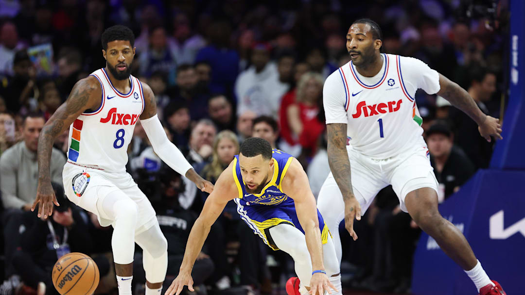 Mar 1, 2025; Philadelphia, Pennsylvania, USA; Golden State Warriors guard Stephen Curry (30) looses control of the ball in front of Philadelphia 76ers forward Paul George (8) and center Andre Drummond (1) during the first quarter at Wells Fargo Center. Mandatory Credit: Bill Streicher-Imagn Images Mar 1, 2025; Philadelphia, Pennsylvania, USA; Golden State Warriors guard Stephen Curry (30) looses control of the ball in front of Philadelphia 76ers forward Paul George (8) and center Andre Drummond (1) during the first quarter at Wells Fargo Center. Mandatory Credit: Bill Streicher-Imagn Images
