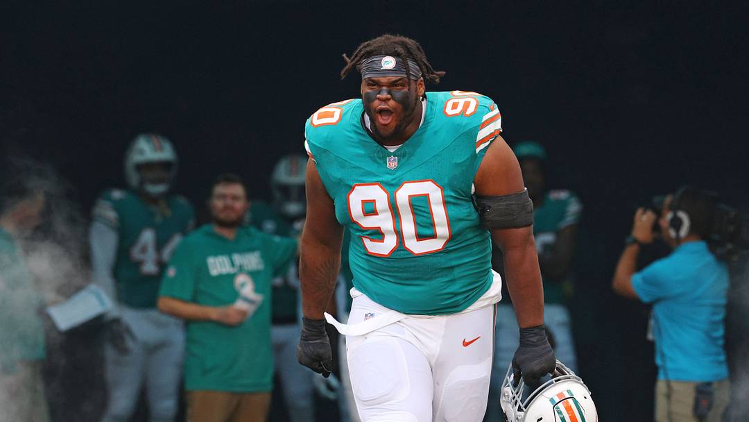 Dec 21, 2025; Miami Gardens, Florida, USA; Miami Dolphins defensive tackle Kenneth Grant (90) enters the field before the game against the Cincinnati Bengals at Hard Rock Stadium. Mandatory Credit: Nathan Ray Seebeck-Imagn Images