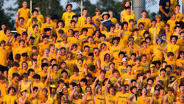 Archbishop Moeller students cheer on the Crusaders.