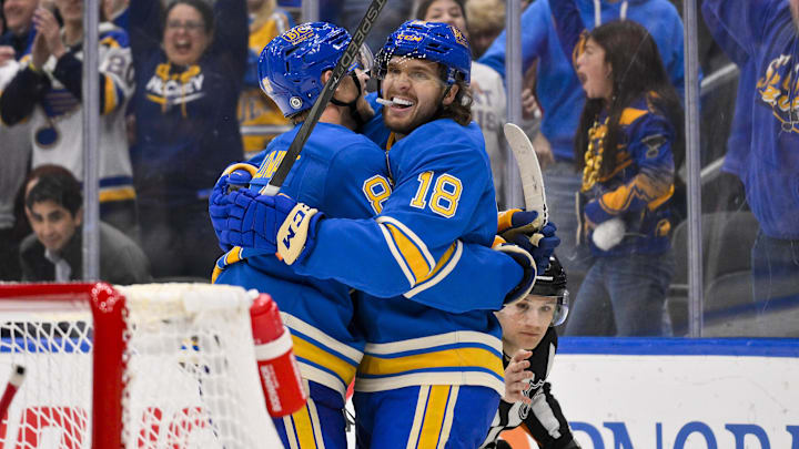 Mar 22, 2025; St. Louis, Missouri, USA; St. Louis Blues center Robert Thomas (18) celebrates with center Dylan Holloway (81) after scoring against the Chicago Blackhawks during the second period at Enterprise Center. Mandatory Credit: Jeff Curry-Imagn Images