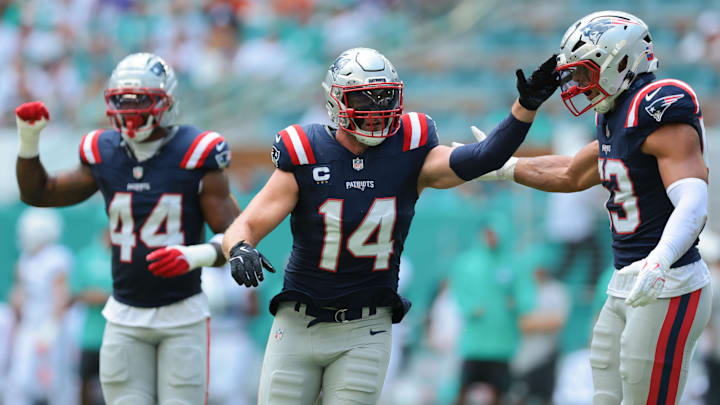 Sep 14, 2025; Miami Gardens, Florida, USA; New England Patriots linebacker Robert Spillane (14) celebrates after a play against the Miami Dolphins during the first quarter at Hard Rock Stadium. Mandatory Credit: Sam Navarro-Imagn Images