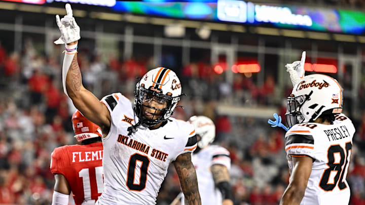 Nov 18, 2023; Houston, Texas, USA; Oklahoma State Cowboys wide receiver Rashod Owens (10) reacts after his touchdown during the fourth quarter against the Houston Cougars at TDECU Stadium. Mandatory Credit: Maria Lysaker-Imagn Images