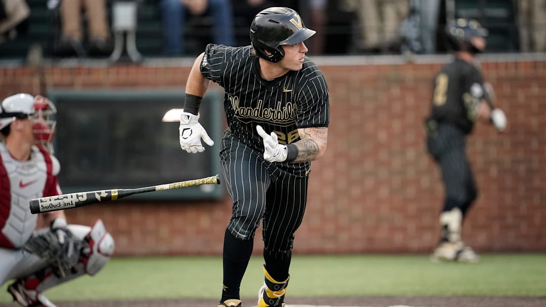 Vanderbilt left fielder Braden Holcomb (26) hits an RBI-double against Oklahoma during the fourth inning at Hawkins Field in Nashville, Tenn., Thursday, April 9, 2026.