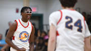 Bryce James, son of NBA star LeBron James, cheers during the E16 Strive for Greatness and Expressions game at the Peach Jam