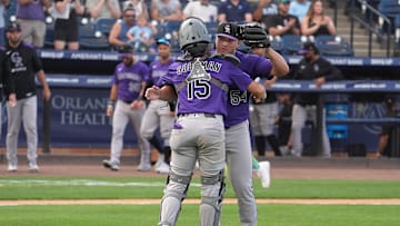 Mar 29, 2025; Tampa, Florida, USA; Colorado Rockies relief pitcher Seth Halvorsen (54) celebrates with catcher Hunter Goodman (15) after defeating the Tampa Bay Rays at George M. Steinbrenner Field. Mandatory Credit: Dave Nelson-Imagn Images