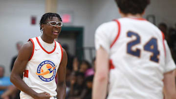 Bryce James, son of NBA star LeBron James, cheers during the E16 Strive for Greatness and Expressions game at the Peach Jam