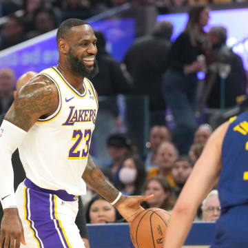 Jan 27, 2024; San Francisco, California, USA; Los Angeles Lakers forward LeBron James (23) reacts while dribbling against Golden State Warriors guard Klay Thompson (11) during the first quarter at Chase Center. Mandatory Credit: Darren Yamashita-USA TODAY Sports