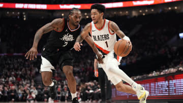 Mar 22, 2024; Portland, Oregon, USA; Portland Trail Blazers shooting guard Anfernee Simons (1) dribbles the ball while defended by  LA Clippers small forward Kawhi Leonard (2) during the first half at Moda Center. Mandatory Credit: Soobum Im-USA TODAY Sports