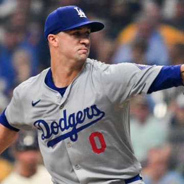 Aug 15, 2024; Milwaukee, Wisconsin, USA; Los Angeles Dodgers starting pitcher Jack Flaherty (0) throws against the Milwaukee Brewers in the first inning at American Family Field. Mandatory Credit: Benny Sieu-USA TODAY Sports