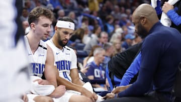 Nov 4, 2024; Oklahoma City, Oklahoma, USA; Orlando Magic guard Jalen Suggs (4) and forward Franz Wagner (22) listen to head coach Jamahl Mosley during a time out against the Oklahoma City Thunder in the second half at Paycom Center. Mandatory Credit: Alonzo Adams-Imagn Images