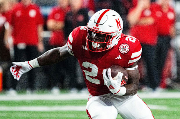 Nebraska Cornhuskers running back Emmett Johnson (21) runs against the Colorado Buffaloes during the fourth quarter.