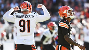 Oct 20, 2024; Cleveland, Ohio, USA; Cincinnati Bengals defensive end Trey Hendrickson (91) celebrates an interception as Cleveland Browns quarterback Dorian Thompson-Robinson (17) walks off the field during the second half at Huntington Bank Field. Mandatory Credit: Ken Blaze-Imagn Images