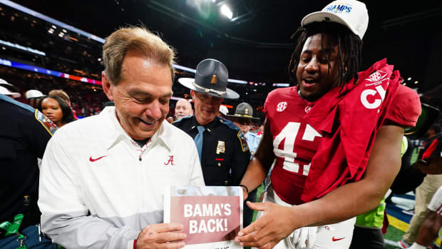 Alabama player and coach celebrate