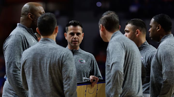 Feb 17, 2026; Gainesville, Florida, USA; Florida Gators head coach Todd Golden huddles with associate head coach Carlin Hartman, assistant coach Dave Klatsky, assistant coach Jonathan Safir, video coordinator Nolan Crist and associate head coach Korey McCray during a timeout against the South Carolina Gamecocks during the second half at Exactech Arena at the Stephen C. O'Connell Center. Mandatory Credit: Matt Pendleton-Imagn Images