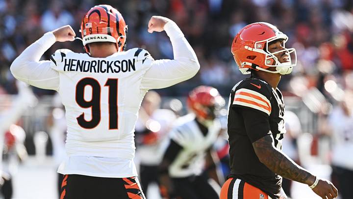 Oct 20, 2024; Cleveland, Ohio, USA; Cincinnati Bengals defensive end Trey Hendrickson (91) celebrates an interception as Cleveland Browns quarterback Dorian Thompson-Robinson (17) walks off the field during the second half at Huntington Bank Field. Mandatory Credit: Ken Blaze-Imagn Images