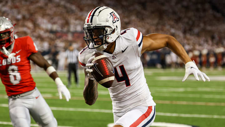 Aug 31, 2024; Tucson, Arizona, USA; New Mexico Lobos safety Christian Ellis (8) chases after Arizona Wildcats wide receiver Tetairoa McMillan (4) as he runs for the touchdown during first quarter at Arizona Stadium.