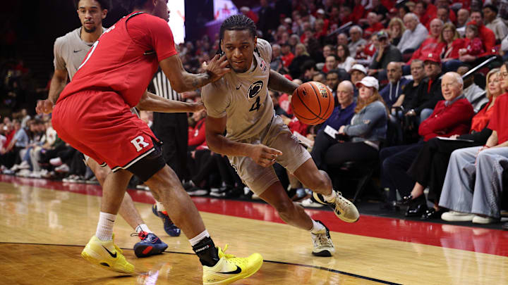Mar 8, 2026; Piscataway, New Jersey, USA; Penn State Nittany Lions guard Kayden Mingo (4) dribbles as Rutgers Scarlet Knights guard Tariq Francis (0) defends during the first half at Jersey Mike's Arena. Mandatory Credit: Vincent Carchietta-Imagn Images