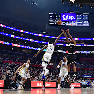 Los Angeles Clippers forward Kawhi Leonard (2) shoots against Golden State Warriors forward Draymond Green (23) during the first half at Crypto.com Arena. 