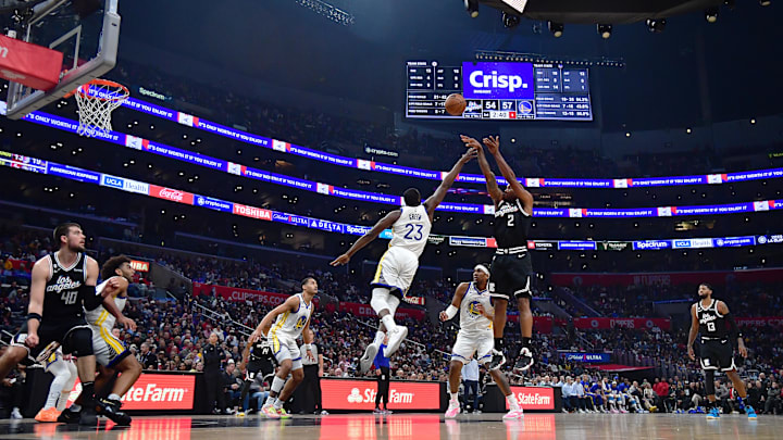 Los Angeles Clippers forward Kawhi Leonard (2) shoots against Golden State Warriors forward Draymond Green (23) during the first half at Crypto.com Arena. 